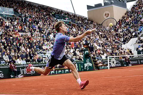 David Goffin plays a shot against Alexander Zverev